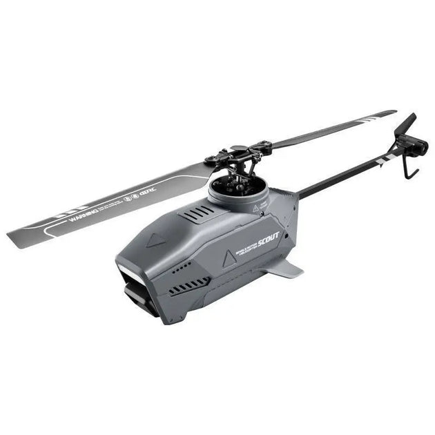 A small helicopter drone with multiple rotors hovering in the air